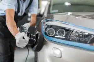 Pro automotive detailer preparing car for sale